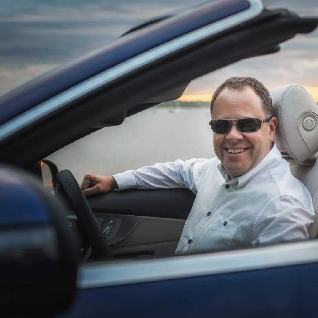 Roy Strong in blue Mercedes convertible from FM World business